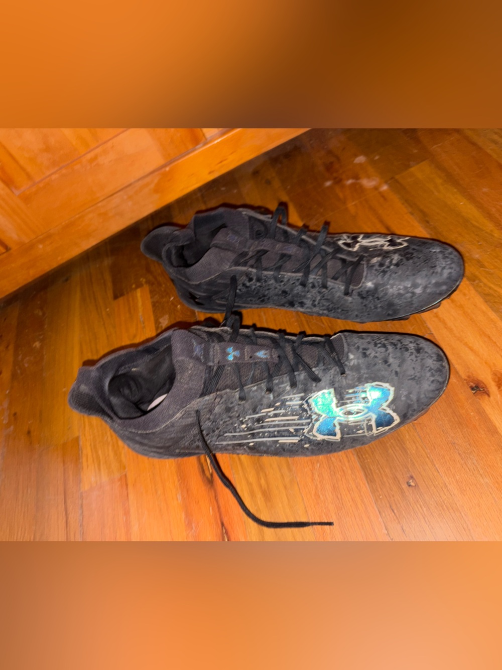 Under Armour Black Cleats with Teal Accent Logo